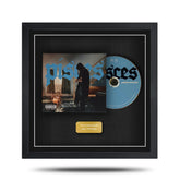 Framed music album with cover and CD inside, featuring a black border.