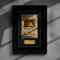 Charizard Holo Pokemon card inside a frame with harsh shadows and contrast. Protect your trading cards from damage and sunlight. Charizard Holo Pokemon card inside a frame with harsh shadows and contrast. Protect your trading cards from damage and sunlight.