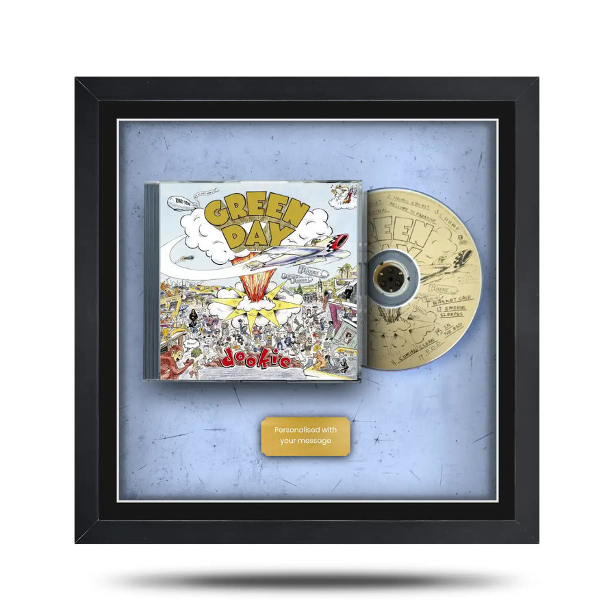 Framed Green Day album cover with CD inside on a light blue background