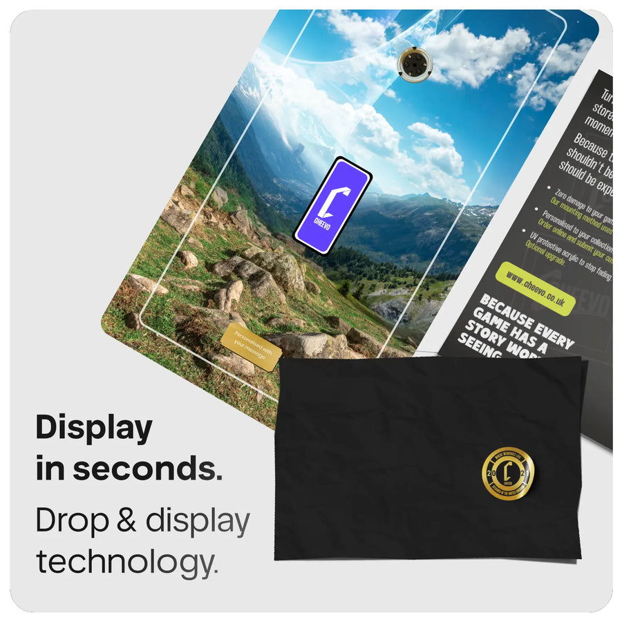Scenic mountain and sky artwork with Cheevo logo and gold plate