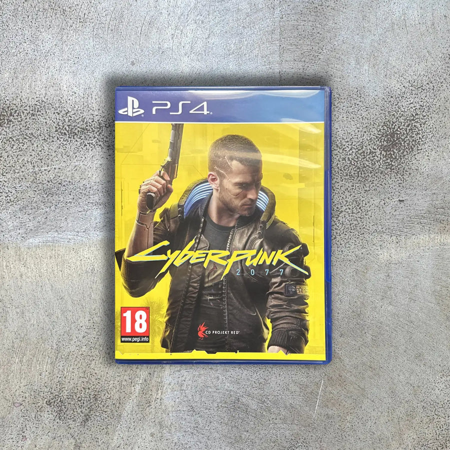PlayStation 4 game case for 'Cyberpunk 2077' on a textured gray surface