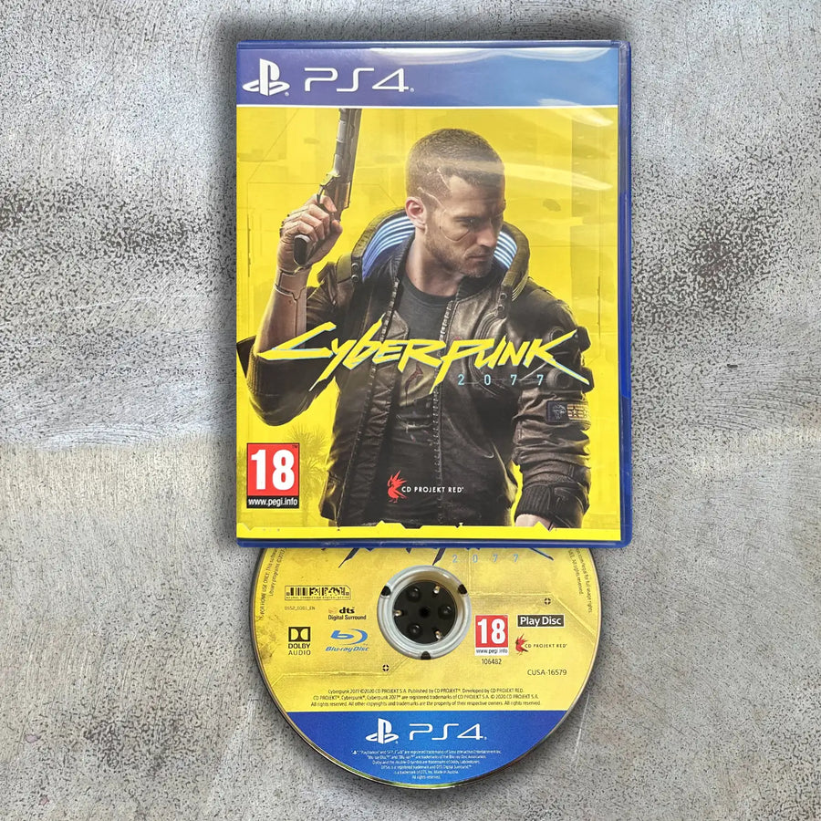 Cyberpunk 2077 game case and disc on a gray surface with disc to the bottom