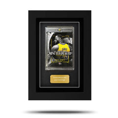 A framed Topps Now basketball card displayed in a black frame with a clear front glass. A framed Topps Now basketball card displayed in a black frame with a clear front glass.