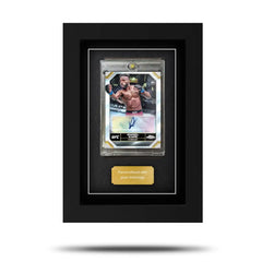 A framed Topps Chrome UFC card displayed within a protective case with a black background, featuring an image of a UFC fighter. A framed Topps Chrome UFC card displayed within a protective case with a black background, featuring an image of a UFC fighter.