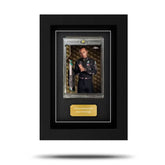A framed Topps Formula 1 trading card displayed in a clear plastic slipcase within a black frame, with a gold name plate below the card.