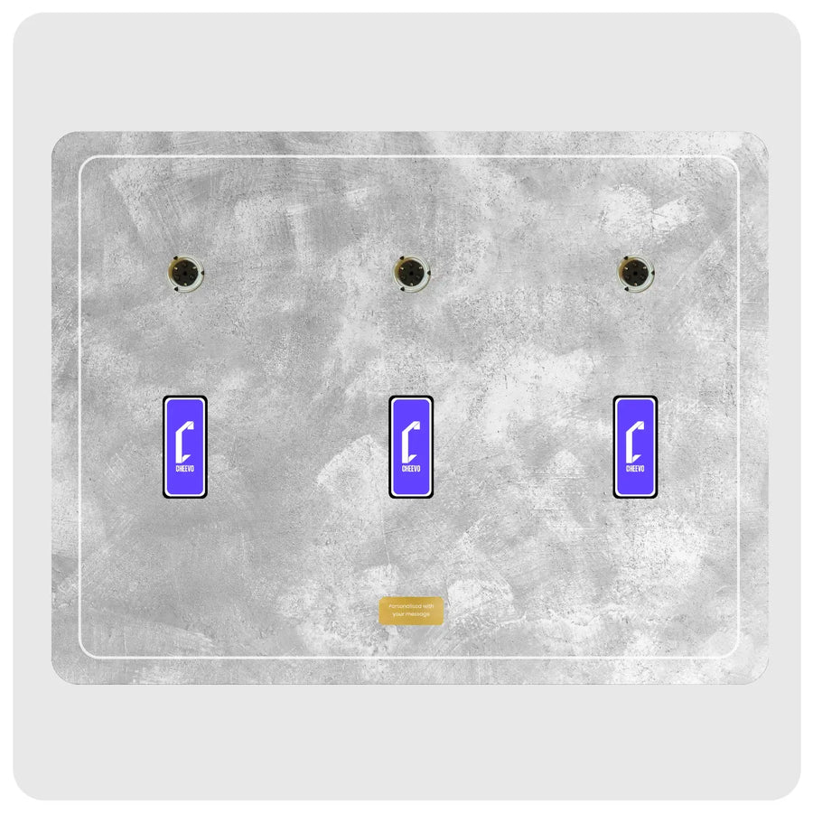 A three-placement plate cover featuring a distressed gray concrete or stone texture, with three DVD spindles at the top and three blue rectangular displays with white Cheevo logos