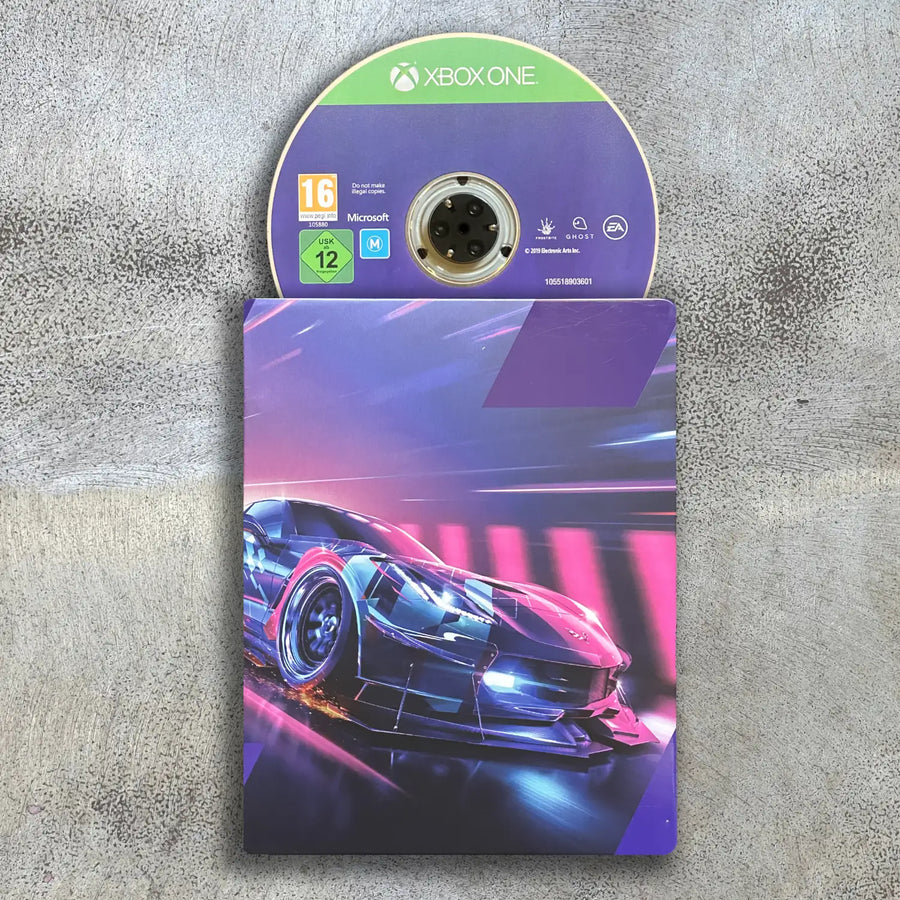 Steelbook game disc and cover for Xbox One on a textured surface