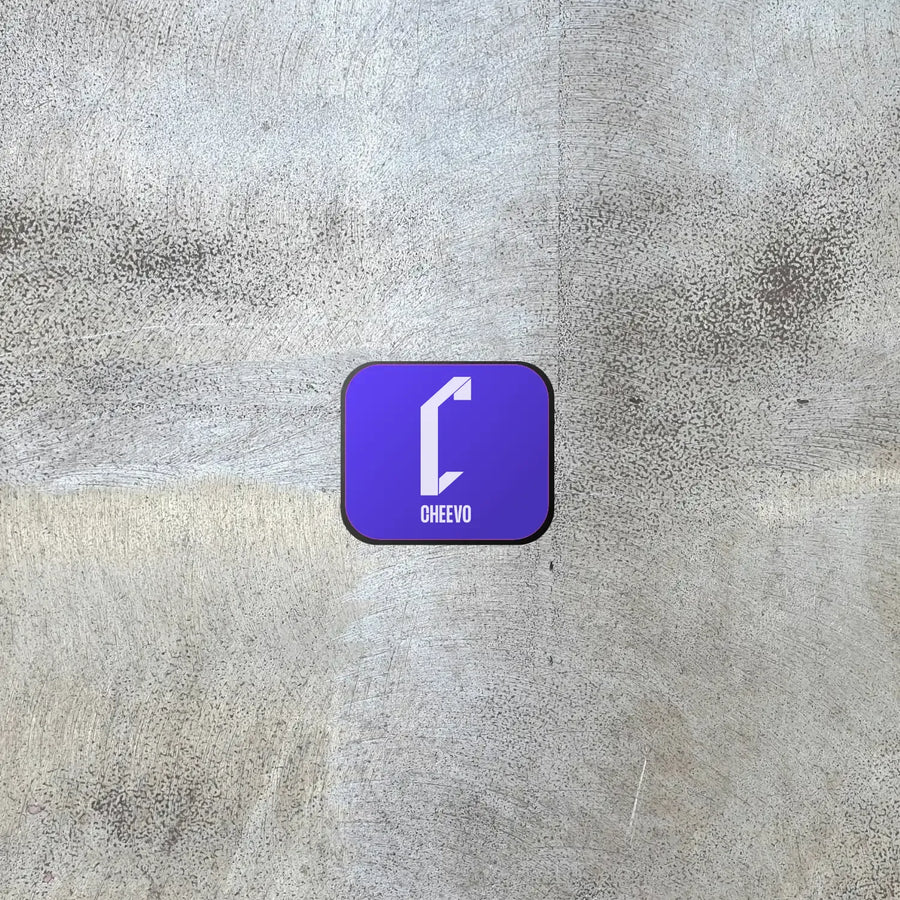 Device to display a video game or movie on a wall magnetically with 'Cheevo' logo on a textured gray background