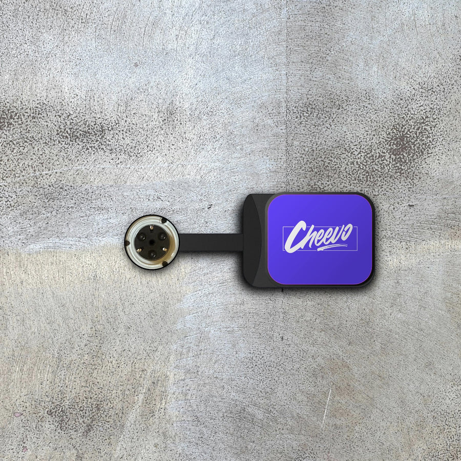 Bracket for displaying a video game or movie on a wall magnetically with 'Cheevo' logo on a textured gray background