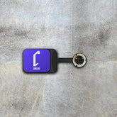 Video game wall display in purple with 'Cheevo' logo on a textured gray surface