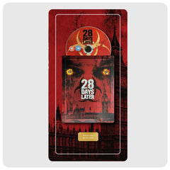 A collectible 28 Days Later movie plate mounted on a red plaque, featuring a circular biohazard symbol and the movie title in bold white text.
