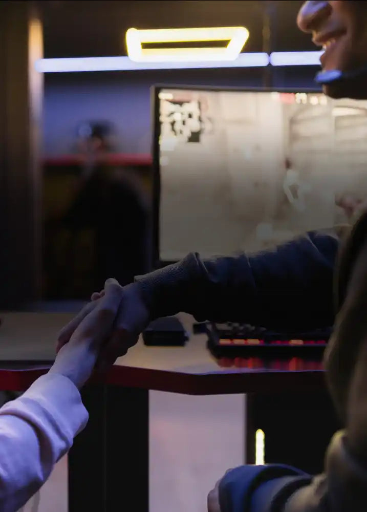 Two people shaking hands whilst building a partnership together