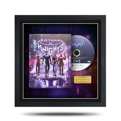 Framed 'Gotham Knights' game disc with cover on a white background