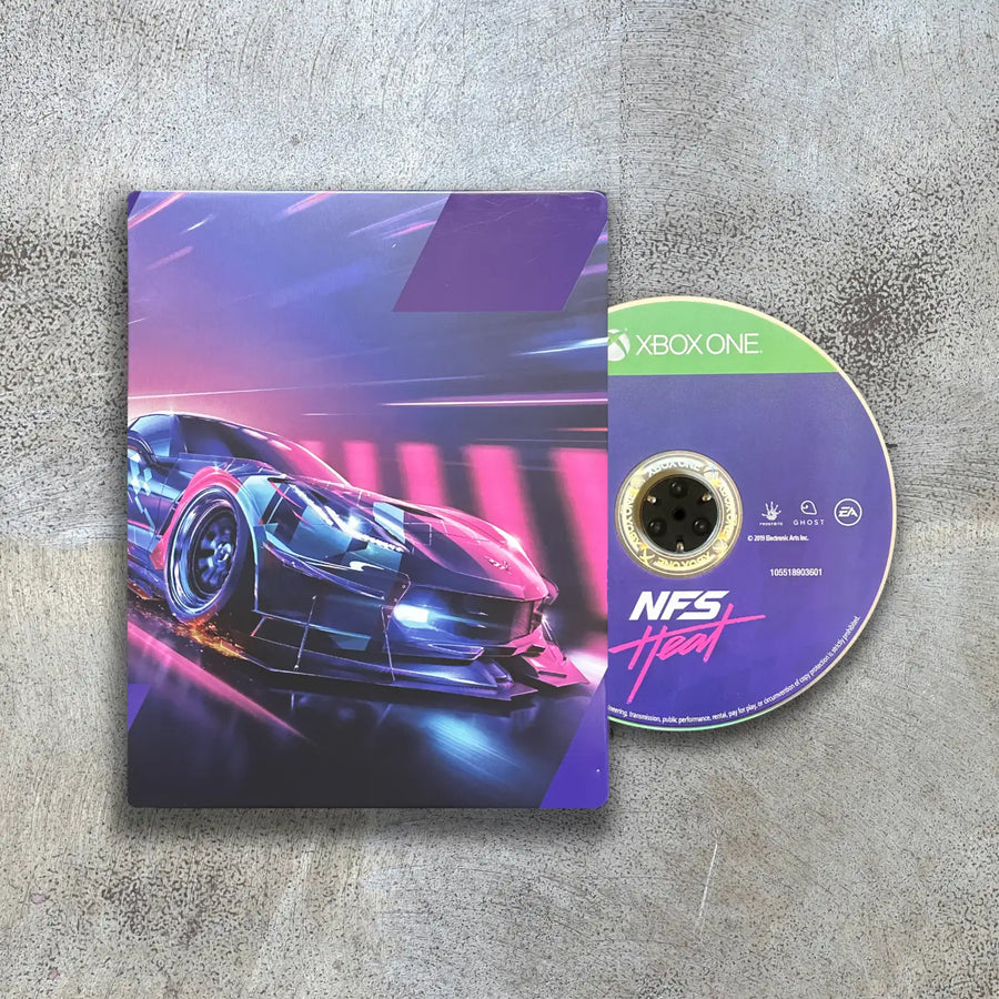 Steelbook game case with disc for 'Need for Speed: Heat' on Xbox One on a textured surface