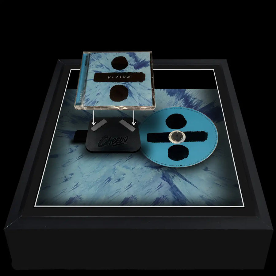 Ed Sheeran Divide CD case and music disc side by side sitting inside a frame