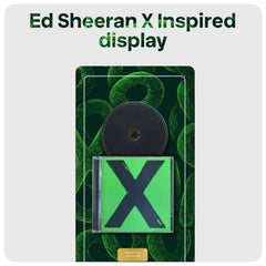 Ed Sheeran X CD Inspired display featuring a green CD case with a large black 'X' on a dark green patterned background, with a black circular disc above it. Text shows 'Ed Sheeran'