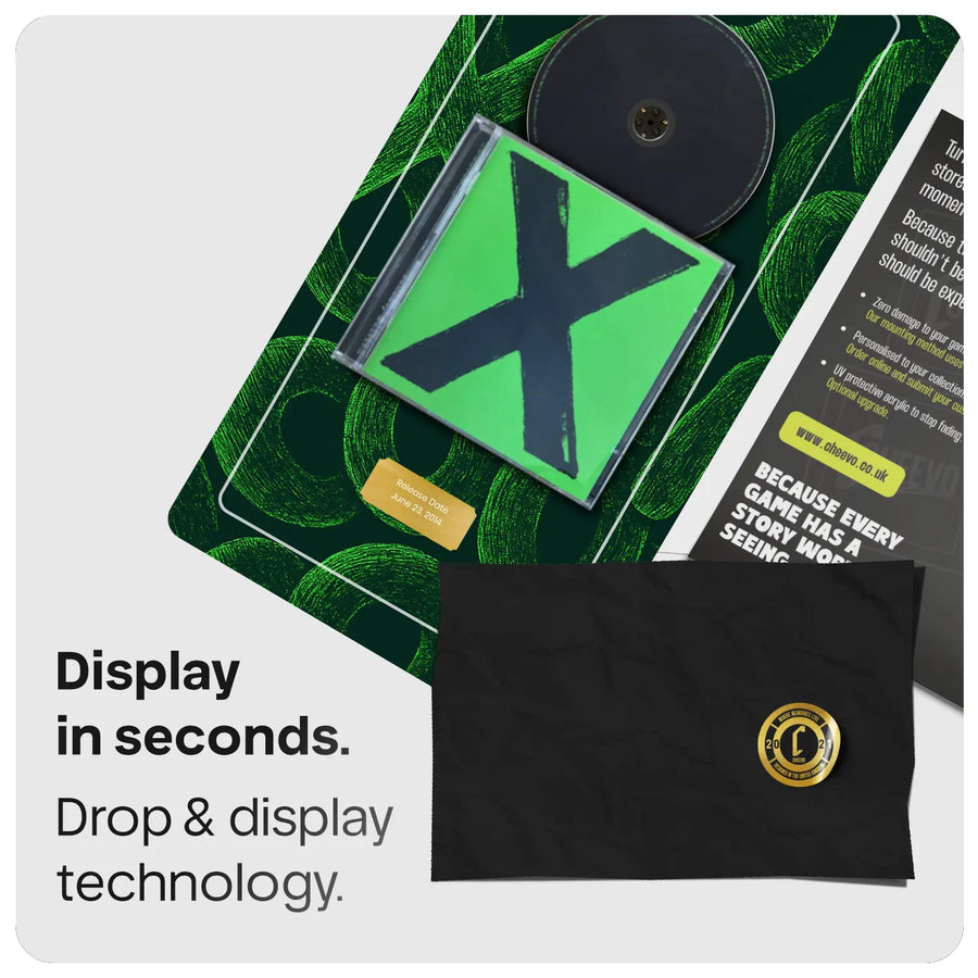 Ed Sheeran 'X' CD and disc on a green artwork displayed with a gold plate