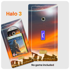 A Halo 3 themed display, featuring a dramatic orange and purple sunset sky with a planet, a DVD spindle, and a small Cheevo logo. The image includes text reading 'Halo 3' and 'No game included', indicating the design is themed after the game but no physical game is supplied.