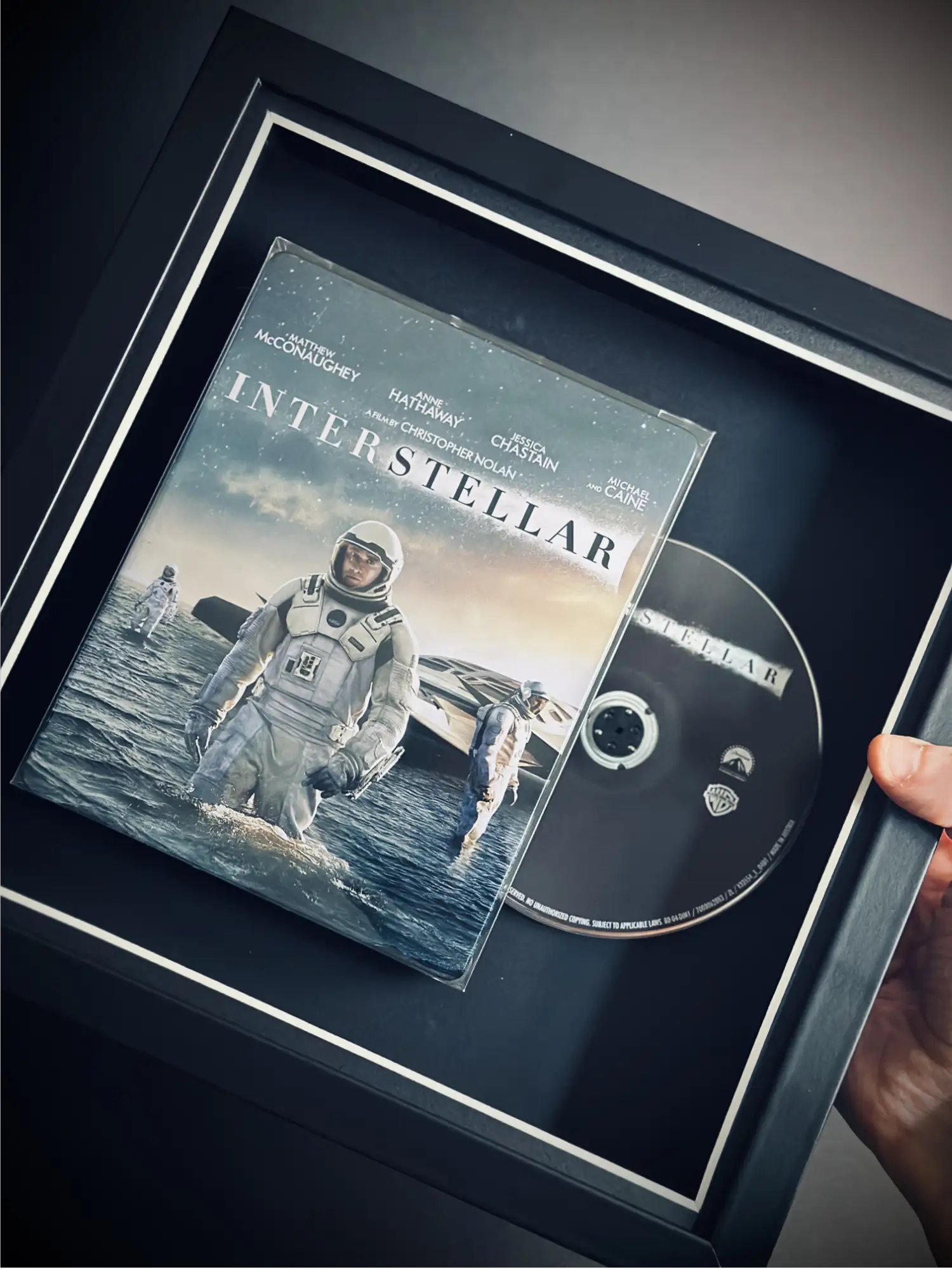 Interstellar Steelbook blu-ray movie inside a square frame as a display