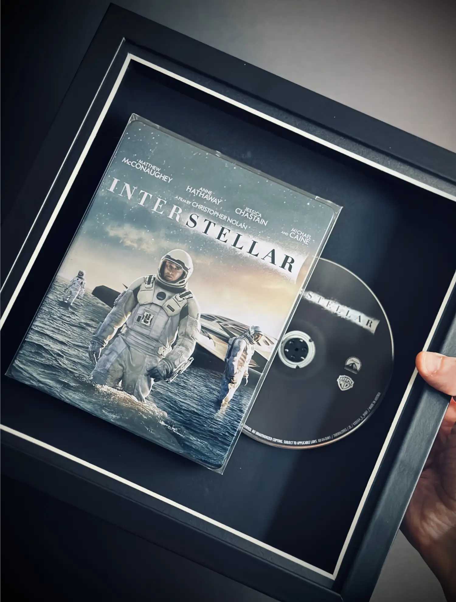 A framed copy of Interstellar 4K Steelbook movie film. Presented in a black frame to display the movie as decor on the wall