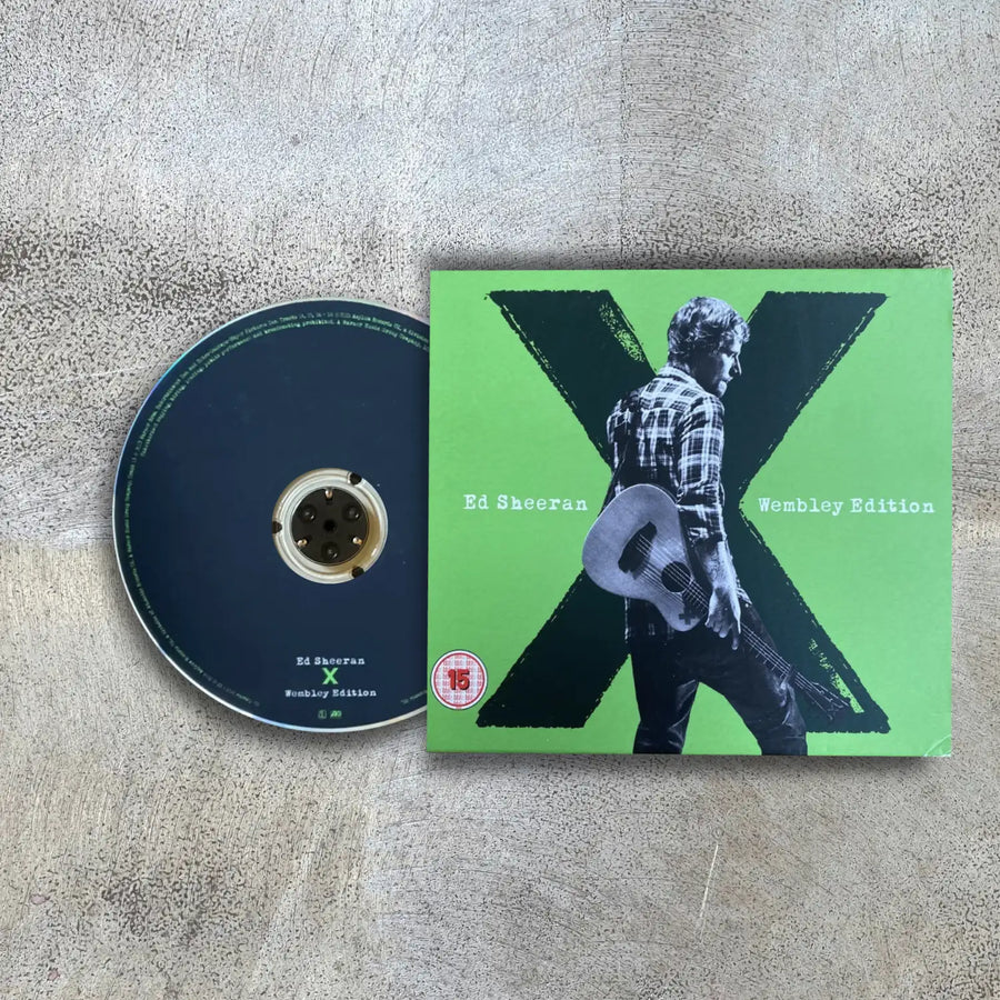 Ed Sheeran 'X' album cover with disc to the left on display on a textured surface
