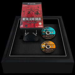 Square black frame showing a Gamecube video game case and two discs displayed side by side