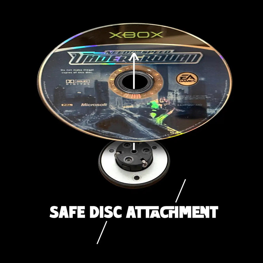 Original Xbox game disc being mounted onto a spindle for presentation