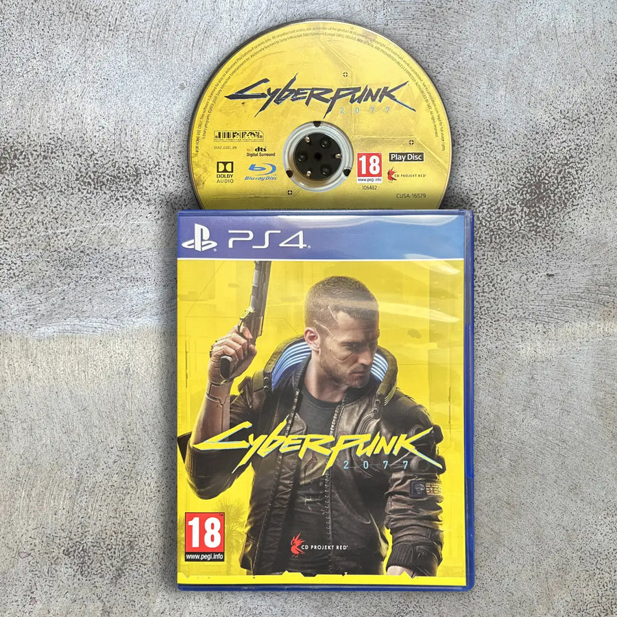 Cyberpunk 2077 game case and disc on a gray surface with disc to the top