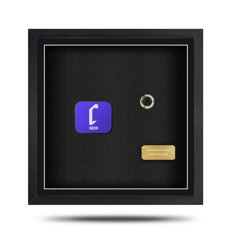 Black framed display case with a purple logo and gold tag inside