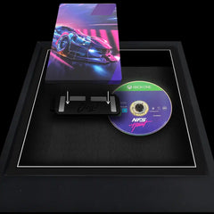Xbox One video game steelbook being added to a frame to be displayed next to the disc.