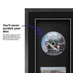 Call of Duty: Black Ops for PlayStation 3 displayed within a frame, featuring a spindle for safely attaching and removing the game disc