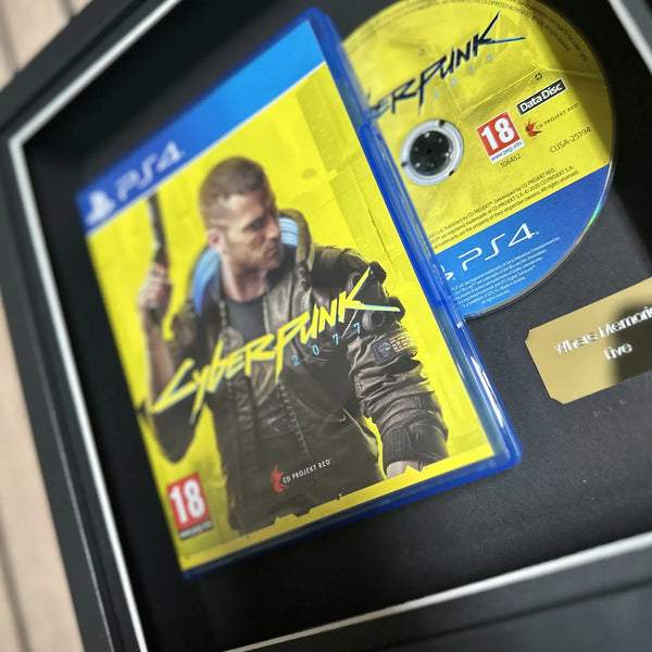 Cyberpunk for Playstation 4 inside of a picture frame from Cheevo ltd, displayed using magnets