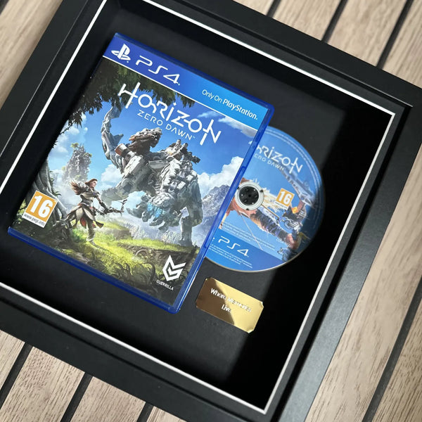 Horizon Zero Dawn for Playstation 4 inside of a picture frame from Cheevo ltd, displayed using magnets