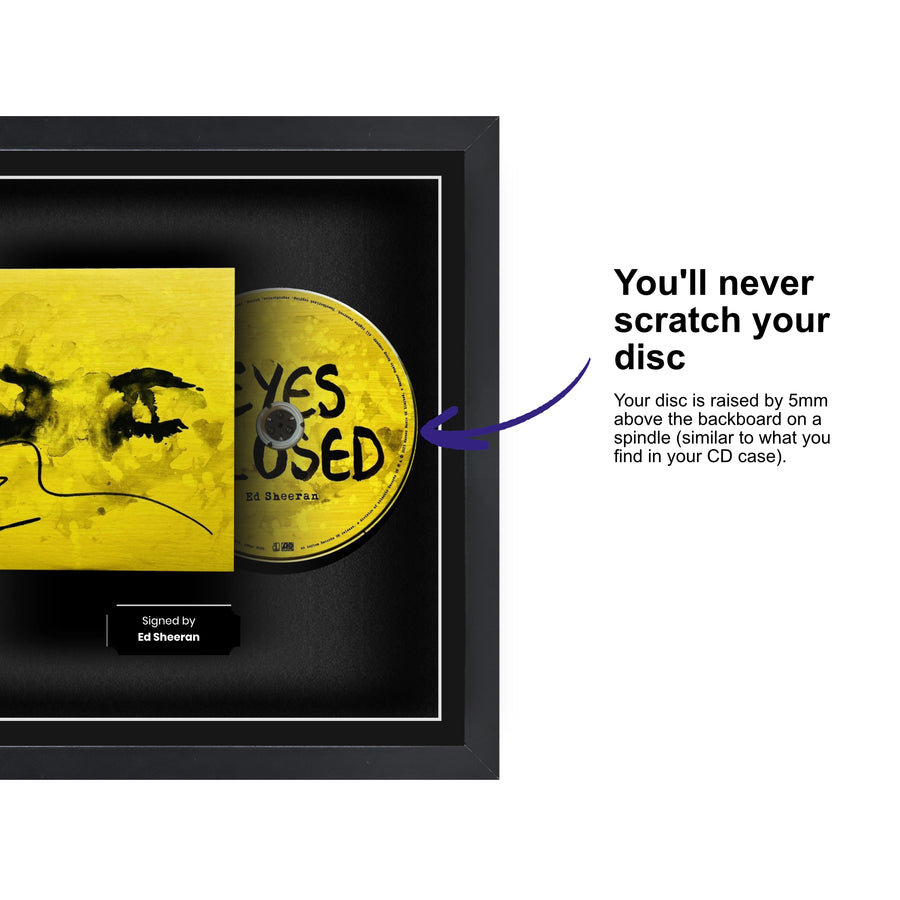 Audio CD displayed inside a frame, featuring a spindle for safely attaching and removing the CD