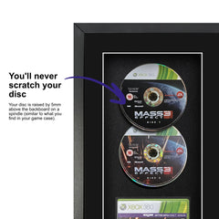 Frame a game: Mass Effect 3 for Xbox 360 displayed inside a frame, featuring a spindle for safely attaching and removing the game disc.