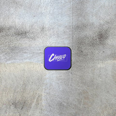 Purple square wall display device with 'Cheero' logo on a textured gray background