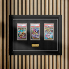 PSA graded picture frame holding three cards in plastic slabs, by Cheevo Ltd