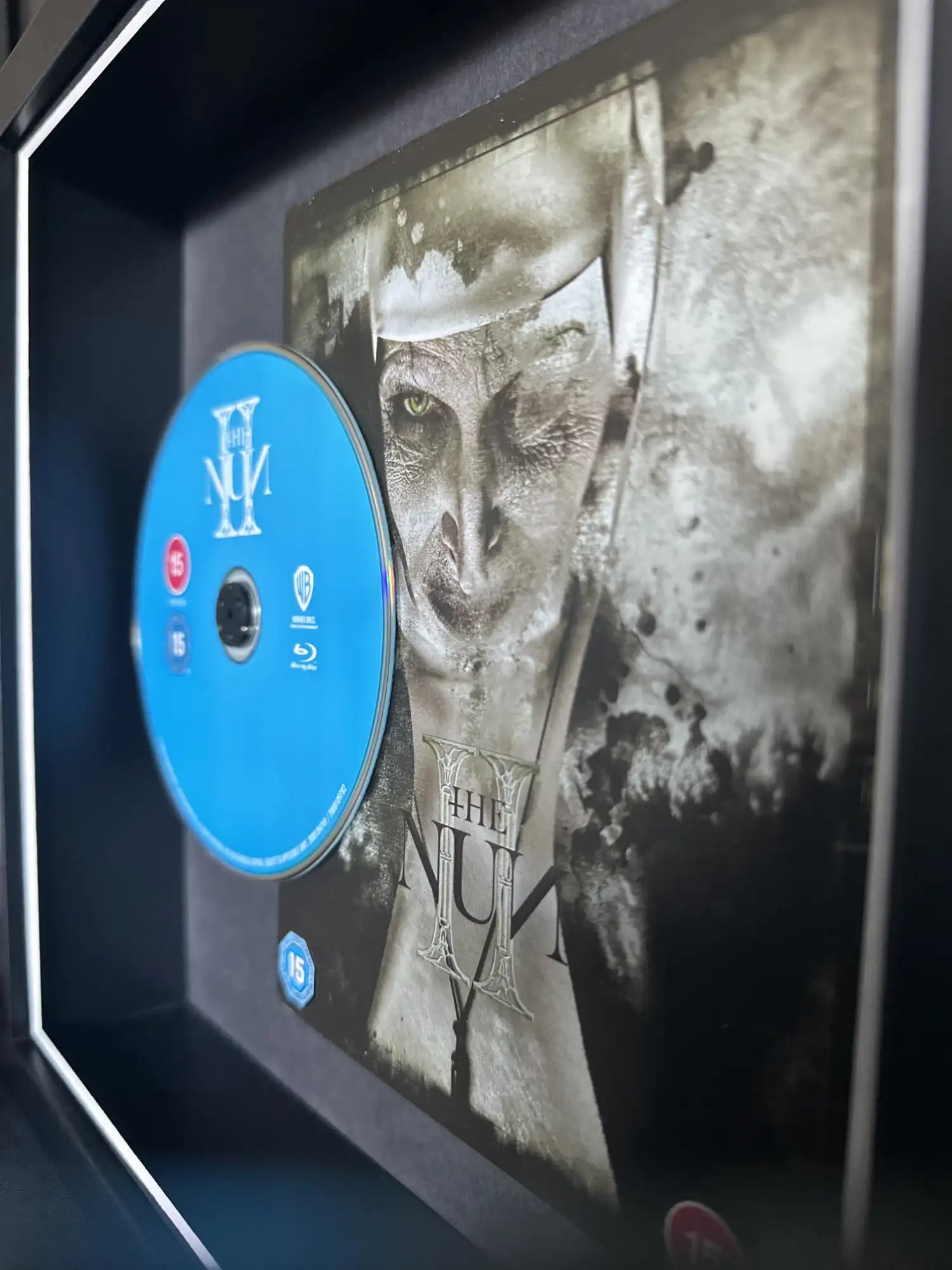 the nun 2 4k movie steelbook displayed in a frame