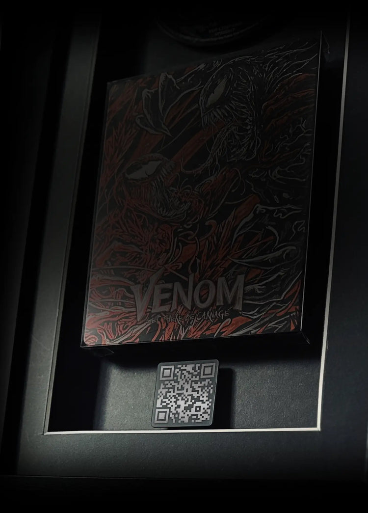 Large black modern frame displaying 'Venom: Let There Be Carnage' steelbook Blu-ray movie with QR code for mobile devices