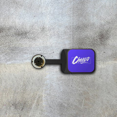 Bracket for displaying a video game or movie on a wall magnetically with 'Cheevo' logo on a textured gray background