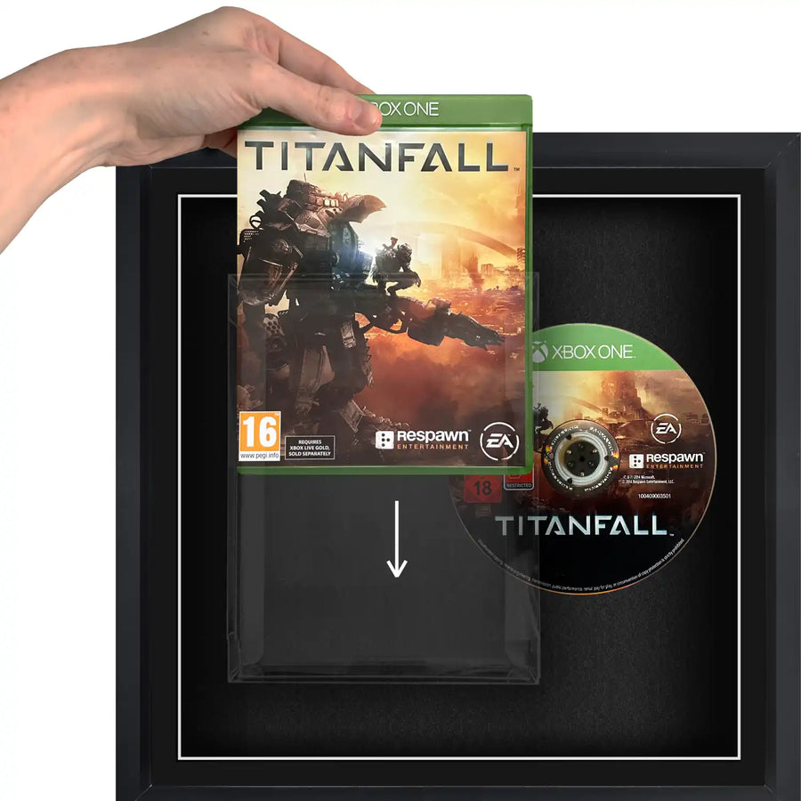 Plastic slipcase with xbox one video game being added into it. The game disc is to the side inside a frame.