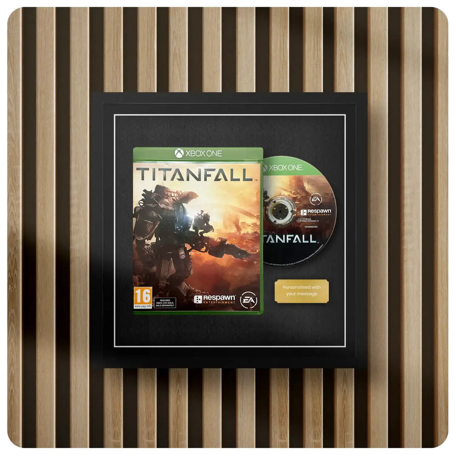 Xbox One game disc and cover for 'Titanfall' displayed in a picture frame