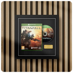 Xbox One game disc and cover for 'Titanfall' displayed in a picture frame